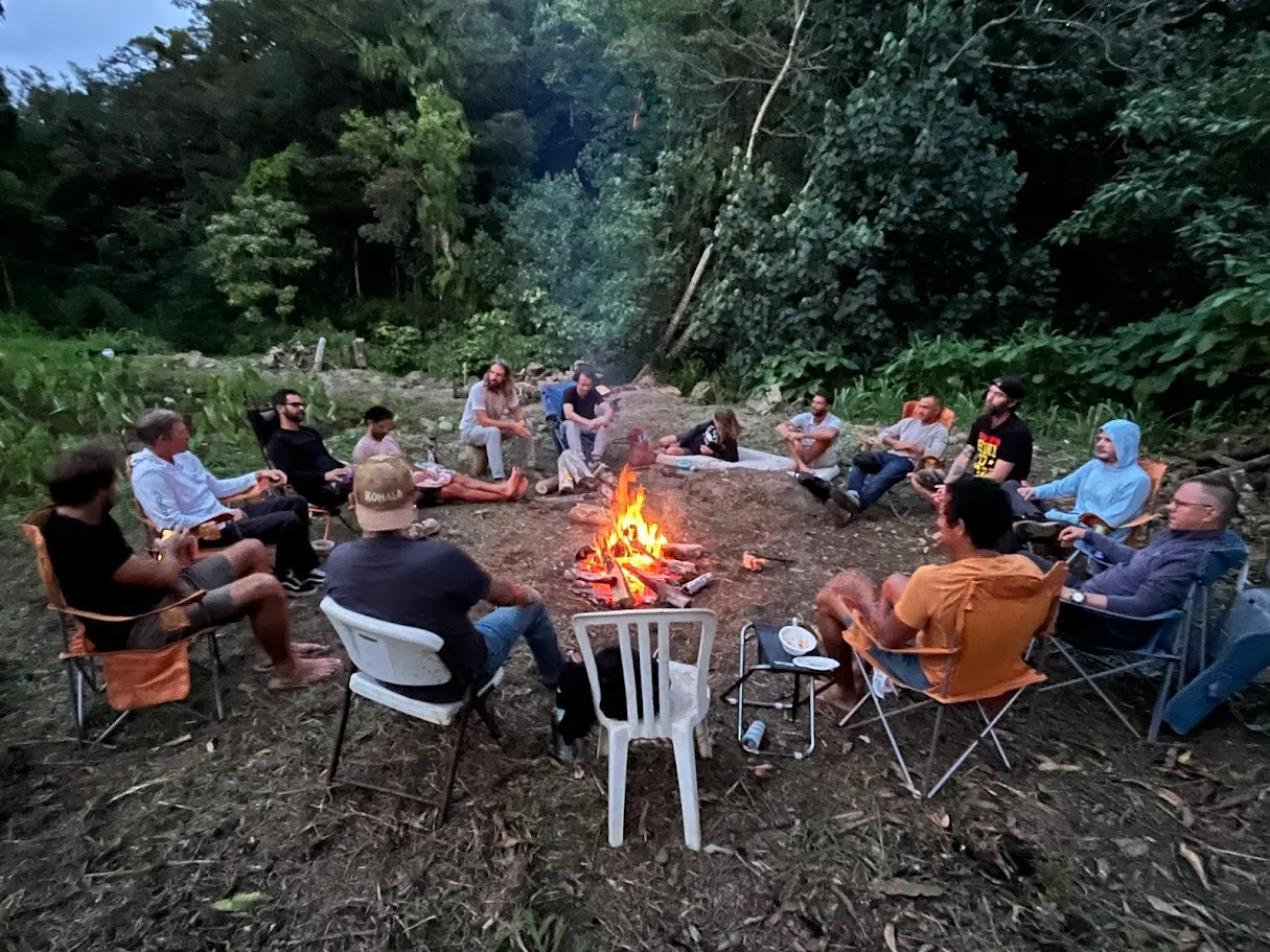 A real Brotherhood circle gathered around a bonfire.