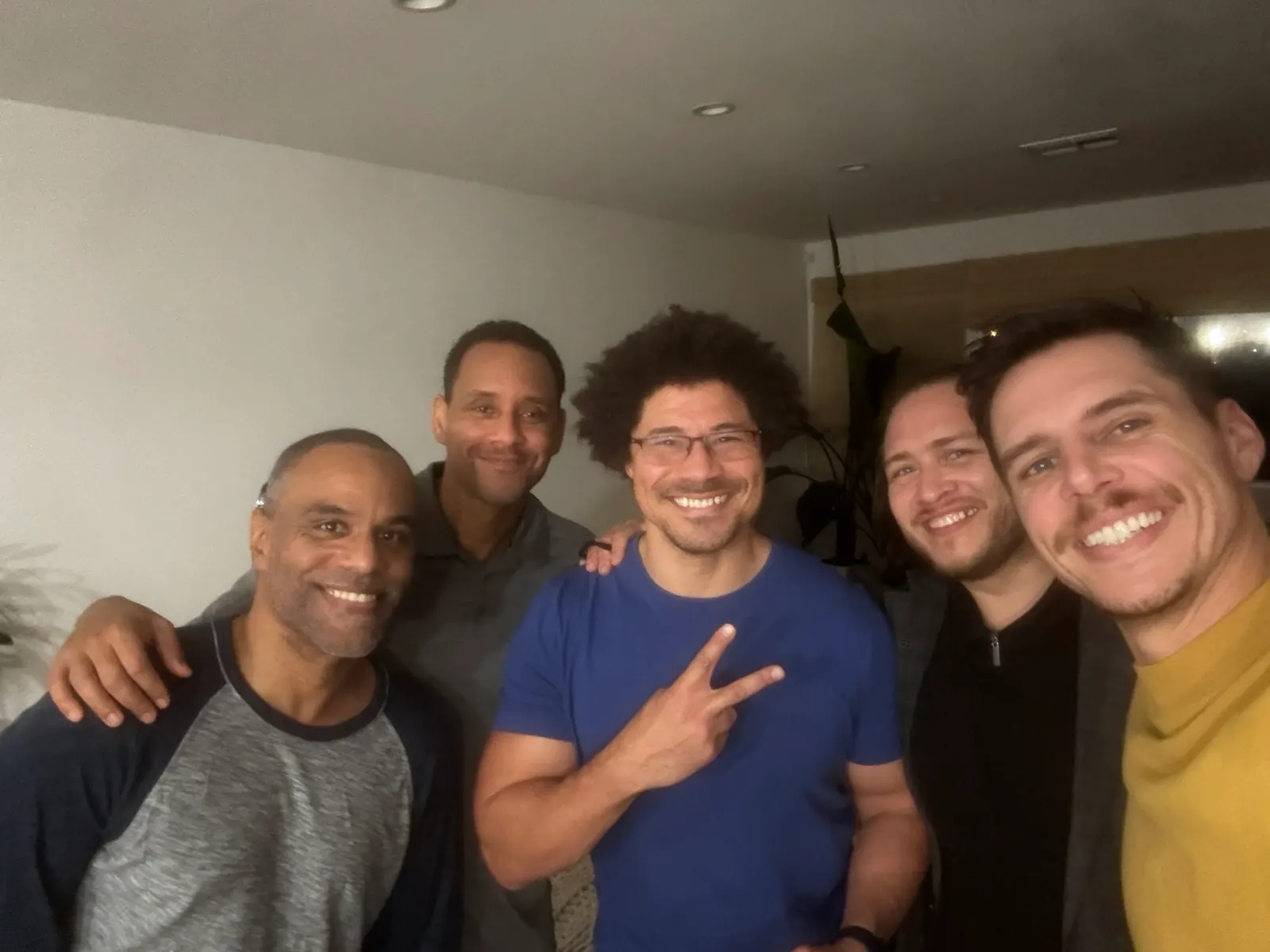 A smiling group of men standing together after a Brotherhood gathering in Inglewood.